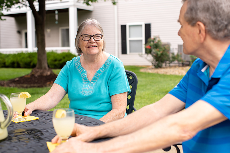 Woman and Man drinking lemonade outside