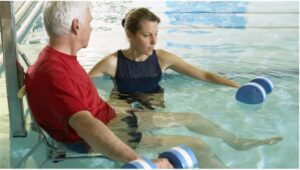 Man does aquatic therapy in a pool